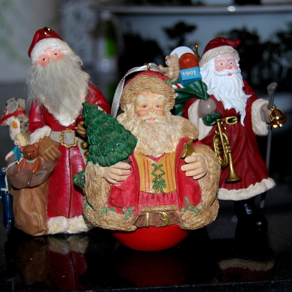 Three Hallmark Santa Ornaments